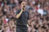 Manchester City's head coach Pep Guardiola shouts during the English Premier League soccer match between Arsenal and Manchester City at the Emirates Stadium in London, Sunday, Oct. 8, 2023.(AP Photo/Kirsty Wigglesworth)