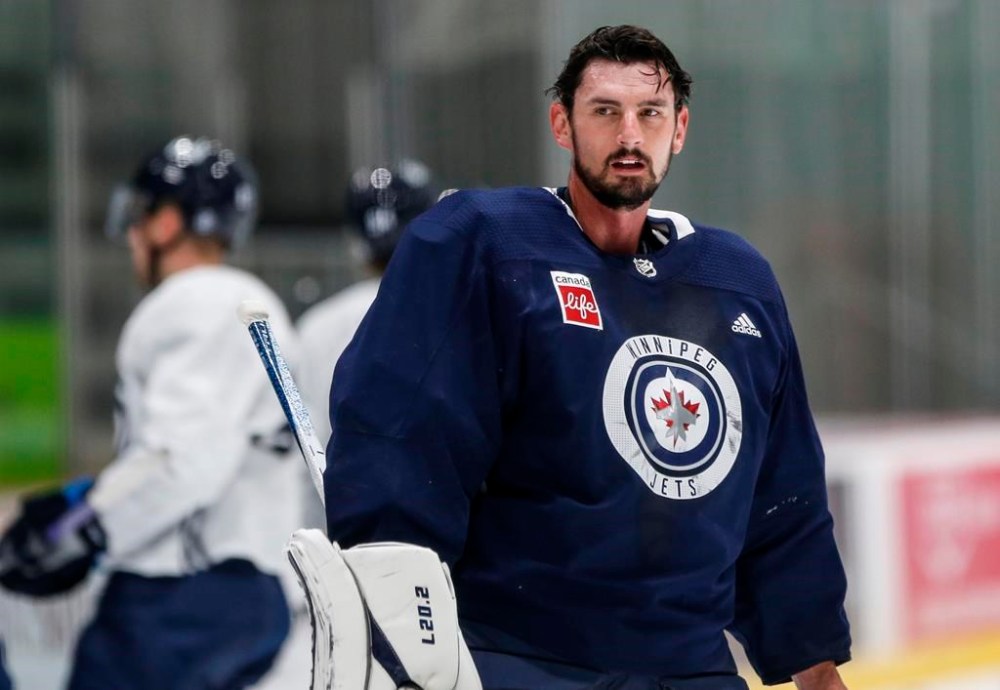Winnipeg Jets goaltender Connor Hellebuyck looks on during opening day of their NHL training camp in Winnipeg, Thursday, Sept. 21, 2023. If an NHL team’s success begins from the net out, the smile on the face of Jets head coach Rick Bowness reinforced his confidence in the team’s goaltenders.THE CANADIAN PRESS/John Woods