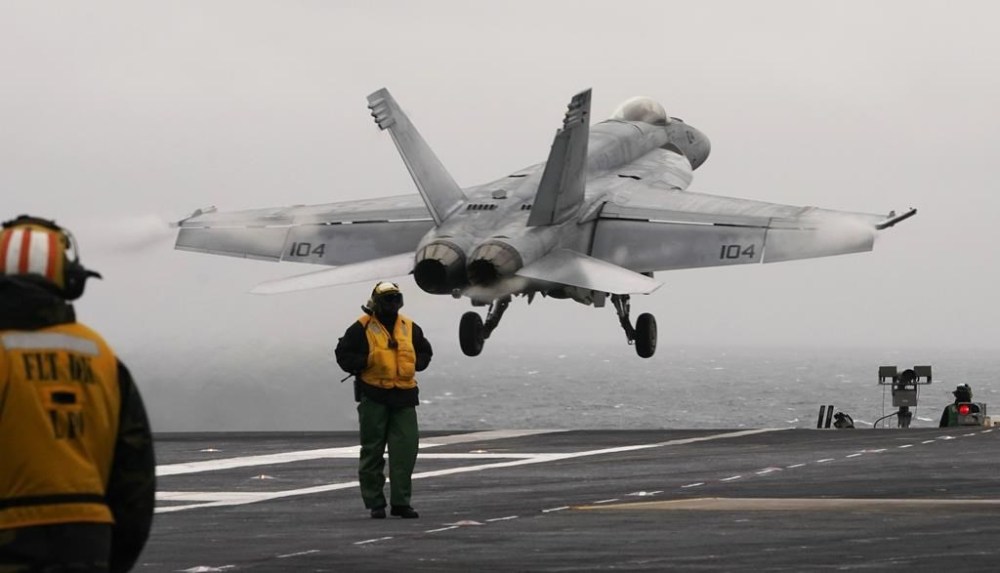 FILE - An F/A-18 E is launched from the deck of the aircraft carrier USS Gerald R. Ford during flight deck operations on Oct. 5, 2022, off the Virginia Coast. The Pentagon has ordered the Ford carrier strike group to sail to the Eastern Mediterranean to be ready to assist Israel, two U.S. officials said Sunday, Oct. 8, 2023. The USS Gerald R. Ford and its approximately 5,000 sailors and deck of warplanes will be accompanied by cruisers and destroyers in a show of force that is meant to be ready to respond to anything, from possibly interdicting additional weapons from reaching Hamas and conducting surveillance. (AP Photo/Steve Helber, File)