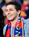 FILE - Israeli soldier Gilad Shalit, right, smiles during a Spanish La Liga soccer match between FC Barcelona and Real Madrid at the Camp Nou stadium in Barcelona, Spain, Oct. 7, 2012. Hamas' 2006 seizure of Shalit consumed Israeli society for years — a national obsession that prompted Israel to heavily bombard the Gaza Strip and ultimately release over 1,000 Palestinian prisoners, many of whom had been convicted of deadly attacks on Israelis, in exchange for Shalit’s freedom. This time, Gaza’s Hamas rulers have abducted dozens of Israeli civilians and soldiers as part of a multipronged, shock attack. (AP Photo/Manu Fernandez, File)
