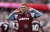 West Ham United's Jarrod Bowen celebrates scoring during the English Premier League soccer match between West Ham United and Sheffield United at London Stadium, London, Saturday Sept. 30, 2023. (Steven Paston/PA via AP)