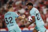 Barcelona's Lamine Yamal celebrates scoring his side's first goal during a Spanish La Liga soccer match between Granada and Barcelona at Los Carmanes Stadium in Granada, Spain, Sunday, Oct. 8, 2023. (AP Photo/Fermin Rodriguez)