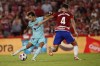 Barcelona's Joao Felix fights for the ball with Granada's Miguel Rubio during a Spanish La Liga soccer match between Granada and Barcelona at Los Carmanes Stadium in Granada, Spain, Sunday, Oct. 8, 2023. (AP Photo/Fermin Rodriguez)