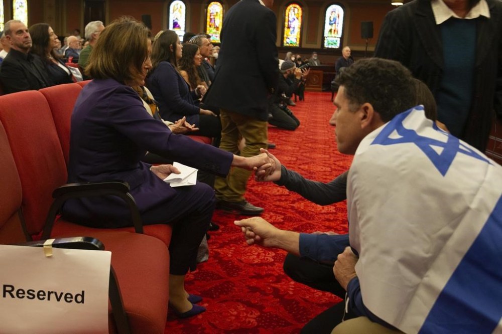 U.S. Rep. Nancy Pelosi, D-Calif., left, greets congregants during