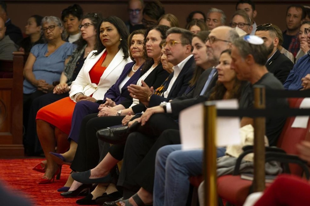 San Francisco Mayor London Breed, left, and U.S. Rep. Nancy Pelosi, D-Calif., listen to remarks during