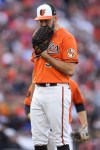Baltimore Orioles starting pitcher Grayson Rodriguez reacts as he sees his manager coming to pull him out of the game during the second inning in Game 2 of an American League Division Series baseball game against the Texas Rangers, Sunday, Oct. 8, 2023, in Baltimore. (AP Photo/Julio Cortez)