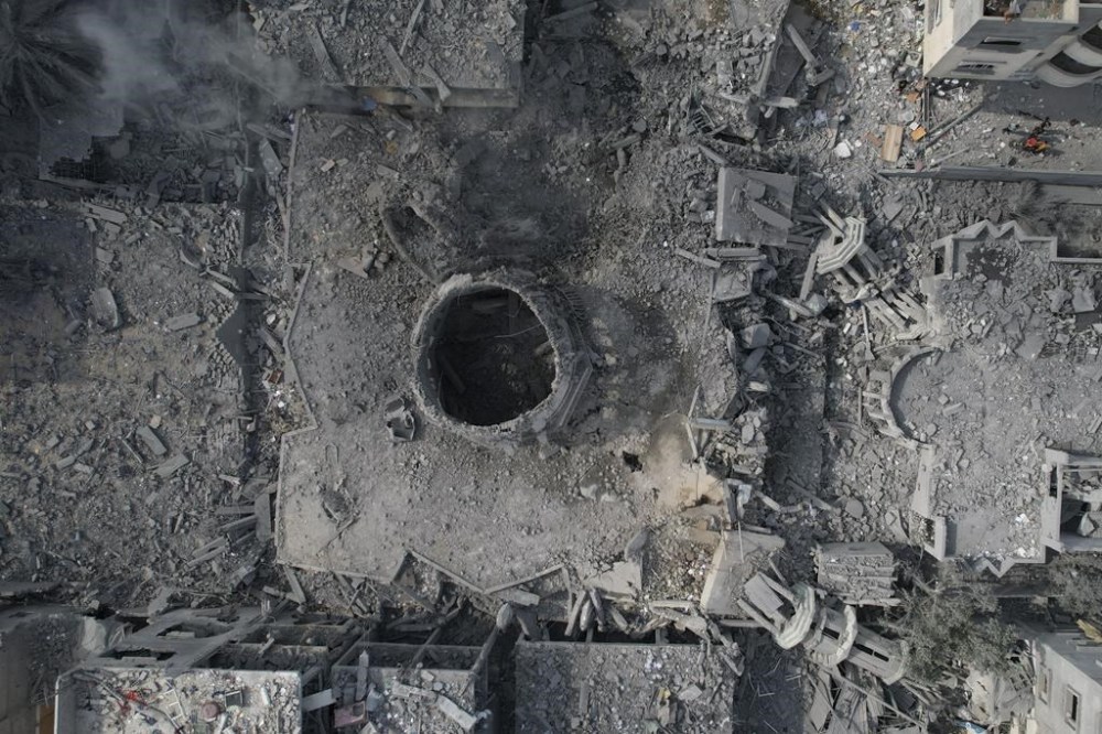 The rubble of the Yassin Mosque, destroyed in an Israeli airstrike, is seen at Shati refugee camp in Gaza City early Monday, Oct. 9, 2023. Israel's military battled to drive Hamas fighters out of southern towns and seal its borders Monday as it pounded the Gaza Strip. (AP Photo/Hatem Moussa)