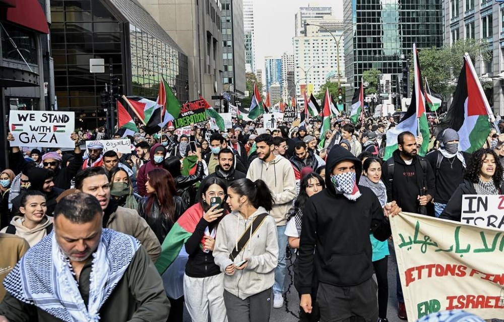 Police are warning the public that there will be no tolerance for violence or hate crimes ahead of an expected large-scale demonstration in solidarity with the Palestinian community in downtown Toronto. People take part in a protest for Palestine in Montreal, Sunday, October 8, 2023. THE CANADIAN PRESS/Graham Hughes
