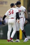 Minnesota Twins pitcher Sonny Gray (54) celebrates with shortstop Carlos Correa after picking off Toronto Blue Jays' Vladimir Guerrero Jr. at second base during the fifth inning of Game 2 of an AL wild-card baseball playoff series Wednesday, Oct. 4, 2023, in Minneapolis. (AP Photo/Abbie Parr)