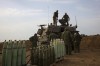 Experts say Canada has limited options as it works diplomatic channels to try preventing clashes in Israel and Palestinian territories from escalating into a wider, regional war. Israeli soldiers take position near the Israeli Gaza border, southern Israel, Monday, Oct. 9, 2023. THE CANADIAN PRESS/AP-Oren Ziv