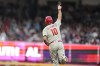 Philadelphia Phillies' J.T. Realmuto (10) runs the bases after his two-run homer in the third inning of Game 2 of a baseball NL Division Series against the Atlanta Braves, Monday, Oct. 9, 2023, in Atlanta. (AP Photo/Brynn Anderson)