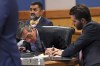 Lawyer Kenneth Chesebro, left, writes as he appears before Judge Scott MacAfee during a motions hearing in the election subversion case Tuesday, Oct. 10, 2023, in Atlanta. Chesebro, indicted in August along with former President Donald Trump and others, is accused of participating in a wide-ranging scheme to illegally try to overturn the results of the 2020 presidential election, which Donald Trump, the Republican incumbent, had lost to Democrat Joe Biden. (Alyssa Pointer/Pool Photo via AP)