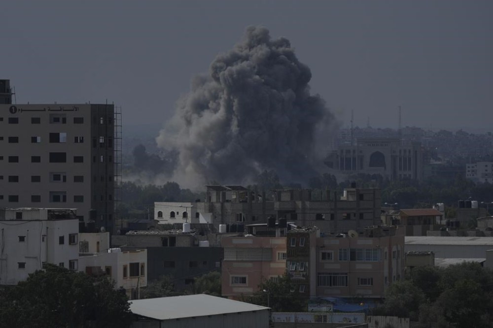 Smoke rises following an Israeli airstrike in Gaza City, Wednesday, Oct. 11, 2023. The militant Hamas rulers of the Gaza Strip carried out an unprecedented, multi-front attack on Israel at daybreak Saturday, firing thousands of rockets as dozens of Hamas fighters infiltrated the heavily fortified border in several locations, killing hundreds and taking captives. Palestinian health officials reported hundreds of deaths from Israeli airstrikes in Gaza. (AP Photo/Hatem Moussa)