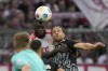 Bayern's Dayot Upamecano, left and Freiburg's Lucas Hoeler challenge for the ball during the German Bundesliga soccer match between FC Bayern Munich and SC Freiburg at the Allianz Arena stadium in Munich, Germany, Oct. 8, 2023. (AP Photo/Matthias Schrader)