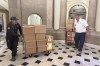 U.S. Capitol staff move boxes out of the Speaker of the House office, Wednesday, Oct. 11, 2023 at the Capitol in Washington. (AP Photo/Serkan Gurbuz)