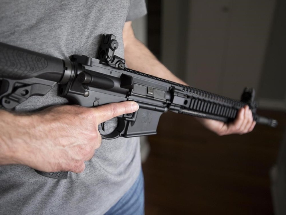 A restricted gun licence holder holds a AR-15 in Langley, B.C. on May 1, 2020. The federal Liberal government says it is extending an amnesty on guns it prohibited in the wake of the deadly Nova Scotia shooting rampage for an extra two years. THE CANADIAN PRESS/Jonathan Hayward