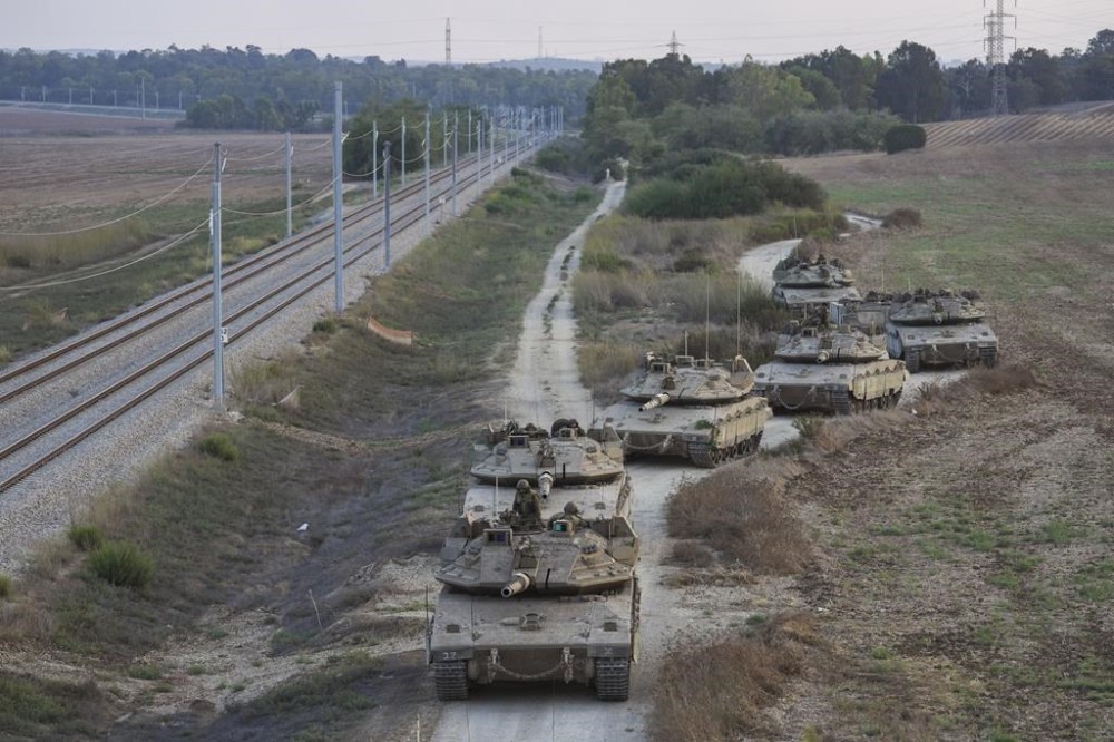 Israeli tanks move near the Israeli Gaza border, Israel, Wednesday, Oct. 11, 2023. (AP Photo/Erik Marmor)