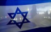 File - A demonstrator is silhouetted behind a flag of Israel during a rally in support of Israel on Oct. 9, 2023, in Bellevue, Wash. Before it transformed into X, Twitter was the place to turn to for live and reliable information about big news events, from wars to natural disasters. But as the Israel-Hamas war has underscored, that is no longer the case. (AP Photo/Lindsey Wasson, File)