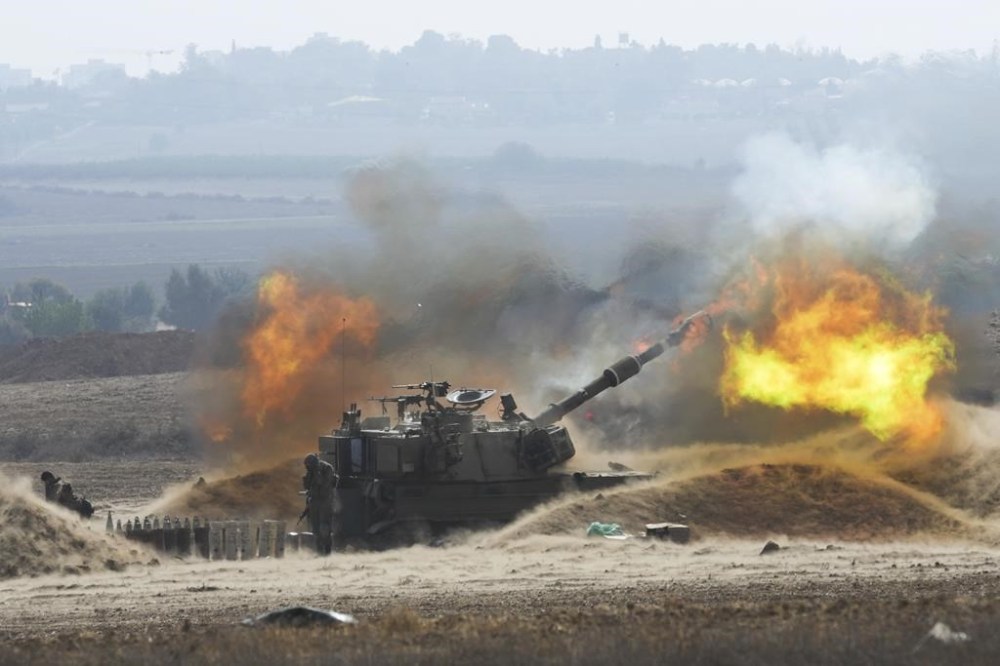 An Israeli mobile artillery unit fires a shell from southern Israel toward the Gaza Strip, in a position near the border, Wednesday, Oct. 11, 2023. THE CANADIAN PRESS/AP-Erik Marmor
