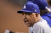 Los Angeles Dodgers manager Dave Roberts reacts during the seventh inning in Game 3 of a baseball NL Division Series against the Arizona Diamondbacks, Wednesday, Oct. 11, 2023, in Phoenix. (AP Photo/Ross D. Franklin)