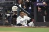 Minnesota Twins' Jorge Polanco watches from the dugout during the fifth inning of Game 4 of a baseball AL Division Series against the Houston Astros, Wednesday, Oct. 11, 2023, in Minneapolis. (AP Photo/Stacy Bengs)