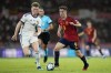 Spain's Gavi runs with the ball followed by Scotland's Scott McTominay, left, during the Euro 2024 group A qualifying soccer match between Spain and Scotland at La Cartuja stadium in Seville, Spain, Thursday, Oct. 12, 2023. (AP Photo/Jose Breton)