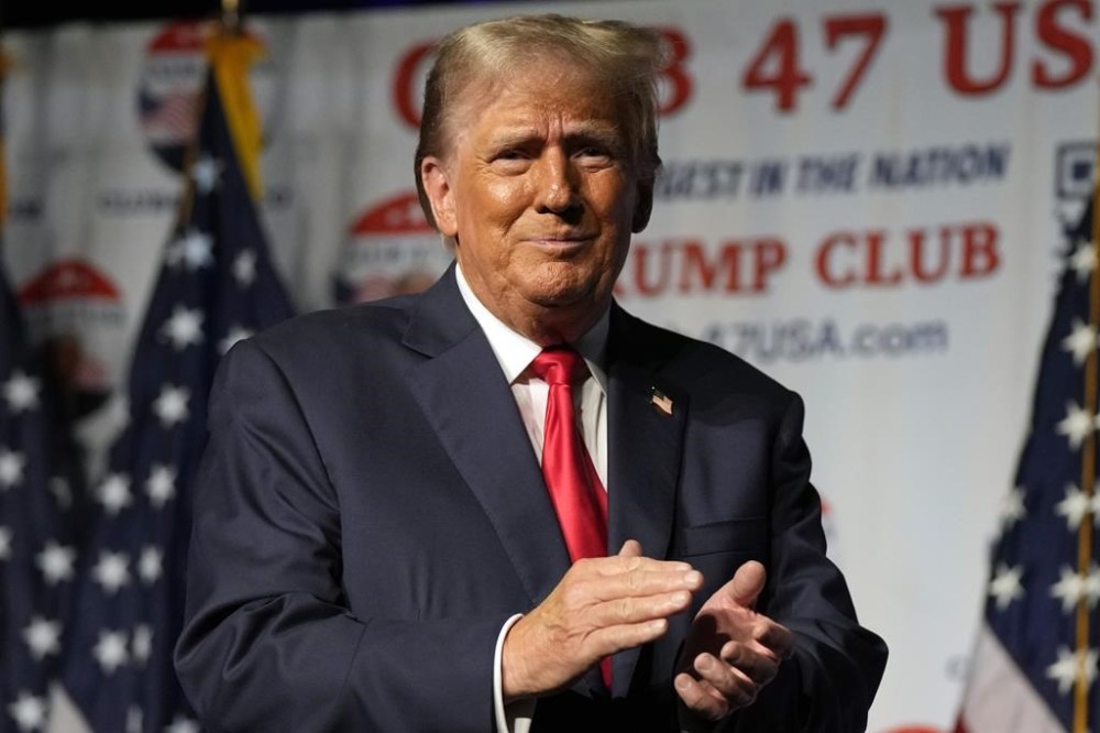 FILE - Republican presidential candidate former President Donald Trump gestures after speaking Wednesday, Oct. 11, 2023, at Palm Beach County Convention Center in West Palm Beach, Fla. A judge has rejected an attempt by Trump to dismiss a lawsuit seeking to keep him off the ballot in Colorado, ruling that his objections on free-speech grounds did not apply. The decision paves the way for a trial later this month over whether a constitutional