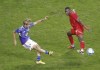 Keito Nakamura, left, of Japan, shoots past Kamal Miller of Canada during a friendly soccer match in Niigata, northern Japan, Friday, Oct. 13, 2023.THE CANADIAN PRESS/AP-Kyodo News via AP
