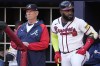 Atlanta Braves manager Brian Snitker (43) stands with Atlanta Braves designated hitter Marcell Ozuna (20) during the first inning of Game 1 of a baseball NL Division Series against the Philadelphia Phillies, Saturday, Oct. 7, 2023, in Atlanta. (AP Photo/John Bazemore)