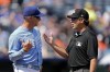 Kansas City Royals manager Matt Quatraro, left, talks to second base umpire James Hoye during the second inning of a baseball game against the Houston Astros Sunday, Sept. 17, 2023, in Kansas City, Mo. (AP Photo/Charlie Riedel)