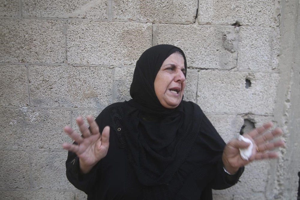 A Palestinian woman reacts during her relative's funeral, killed by an Israeli airstrike, in Rafah, Gaza Strip, Friday, Oct. 13, 2023. (AP Photo/Hatem Ali)