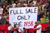 Football supporters show a banner before the start of the English Premier League soccer match between Manchester United and Brentford at the Old Trafford stadium in Manchester, England, Saturday, Oct. 7, 2023.(AP Photo/Jon Super)