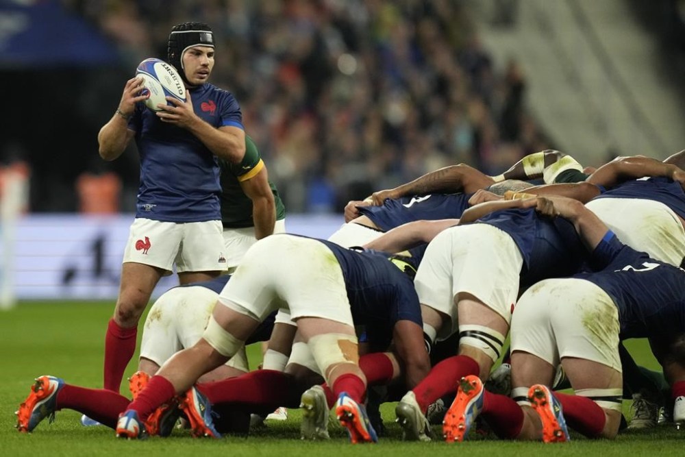 France's Antoine Dupont prepares to feed the ball into a scrum during the Rugby World Cup quarterfinal match between France and South Africa at the Stade de France in Saint-Denis, near Paris Sunday, Oct. 15, 2023. (AP Photo/Thibault Camus)