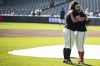 San Francisco Giants Brandon Crawford (35) embraces assistant coach Alyssa Nakken before an MLB baseball game against the Los Angeles Dodgers in San Francisco, Sunday, Oct. 1, 2023. (Stephen Lam/San Francisco Chronicle via AP)