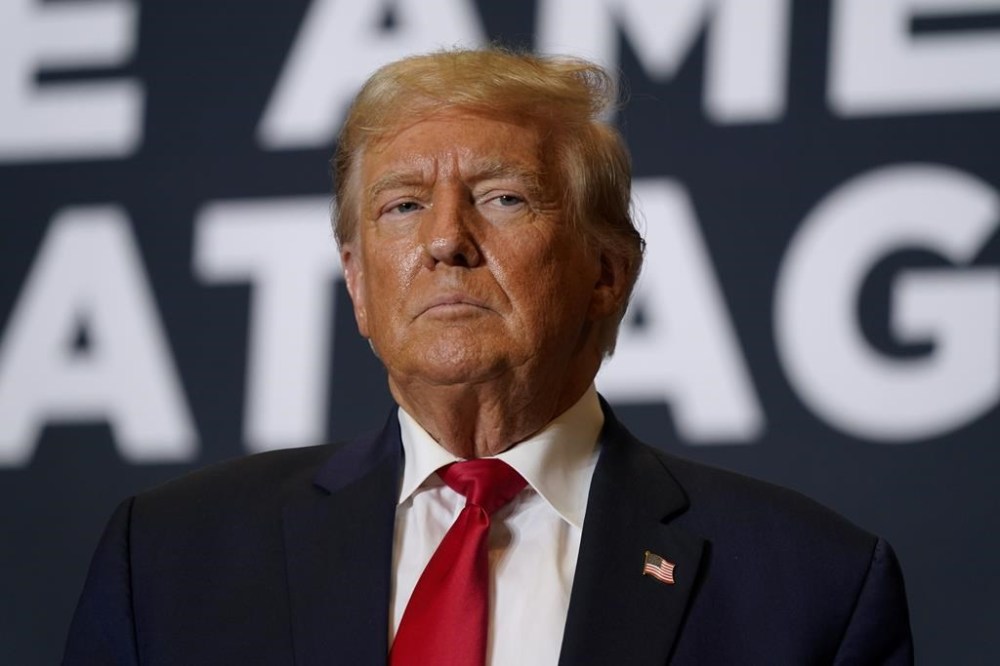 FILE - Former President Donald Trump arrives at a commit to caucus rally, Saturday, Oct. 7, 2023, in Cedar Rapids, Iowa. Federal prosecutors and lawyers for Donald Trump will argue in court Monday, Oct. 16, over a proposed gag order aimed at reining in the former president's diatribes against likely witnesses and others in his 2020 election interference case in Washington. (AP Photo/Charlie Neibergall, File)