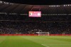 Supporters lit their mobile phones lights after suspension of the Euro 2024 group F qualifying soccer match between Belgium and Sweden at the King Baudouin Stadium in Brussels, Monday, Oct. 16, 2023. Two Swedes were killed in a shooting late Monday in central Brussels, police said, prompting Belgium's prime minister and senior Cabinet minister to hunker down at their crisis center for an emergency meeting. (AP Photo/Geert Vanden Wijngaert)