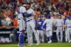 Texas Rangers' Jose Leclerc and Jonah Heim celebrate after Game 2 of the baseball AL Championship Series against the Houston Astros Monday, Oct. 16, 2023, in Houston. The Rangers won 5-4 to take a 2-0 lead in the series. (AP Photo/David J. Phillip)