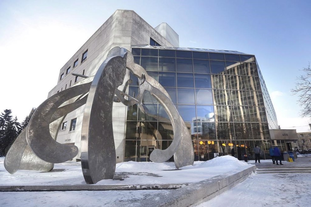 A Manitoba courtroom was adorned with cultural symbols and items as pre-trial proceedings for alleged serial killer Jeremy Skibicki began Monday. People enter the Law Courts in Winnipeg, Monday, Feb. 5, 2018. THE CANADIAN PRESS/John Woods