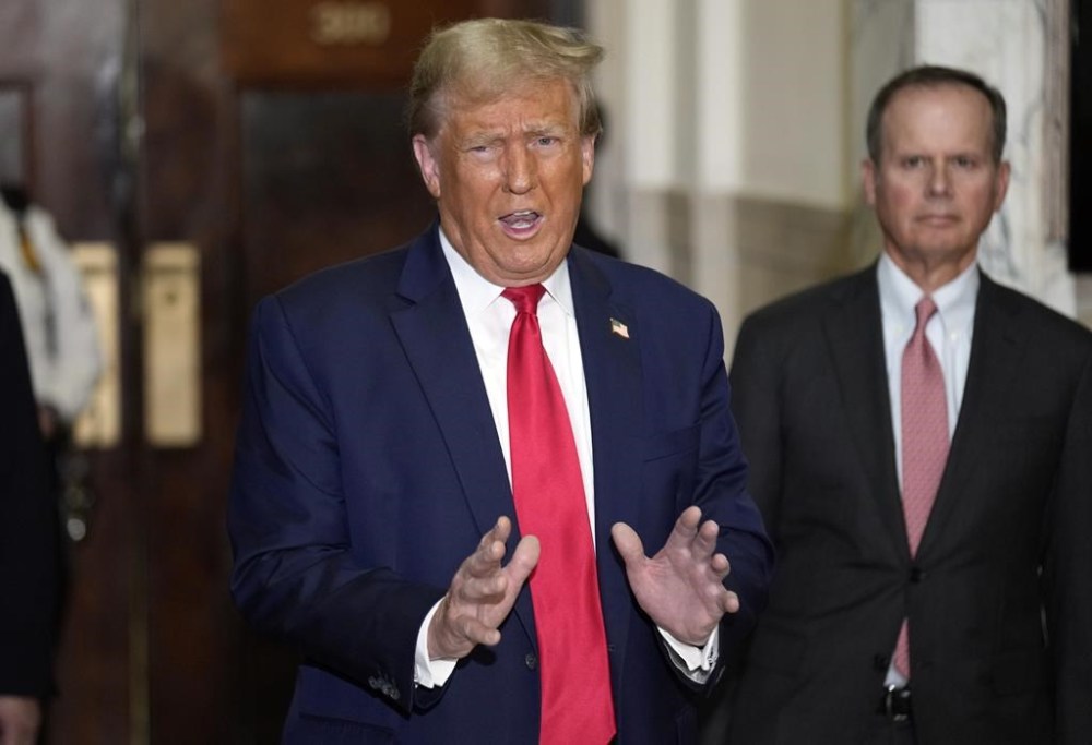 Former President Donald Trump arrives for his civil business fraud trial at New York Supreme Court, Tuesday, Oct. 17, 2023, in New York. (AP Photo/Seth Wenig)