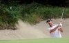 FILE - Geoff Ogilvy of Australia hits out a bunker during the Australian Masters Golf tournament at Victoria Golf Club in Melbourne, Australia, on Sunday, Dec. 18, 2011. Ogilvy is in his third year organizing a tournament that divides the field among men and women, pros and juniors, and is played over four of Melbourne's sandbelt courses. (AP Photo/Andrew Brownbill, File)