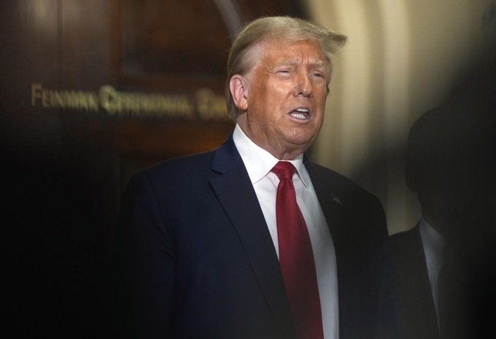 Former President Donald Trump comments as he briefly exits the courtroom in his civil business fraud trial at New York Supreme Court, Tuesday, Oct. 17, 2023, in New York. (AP Photo/Seth Wenig)