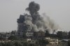 Smoke rises from an explosion caused by Israeli airstrikes on the border between Egypt and Rafah, Gaza Strip, Tuesday, Oct. 10, 2023. More than half of Canadians polled about the ongoing war in Israel and Gaza said they don't believe a lasting peace between Israelis and Palestinians is possible. THE CANADIAN PRESS/AP-Hatem Ali