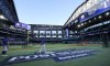The Texas Rangers hold a team baseball practice with the roof open in Arlington, Texas, Tuesday, Oct. 17, 2023. The Rangers are scheduled to play the Houston Astros in Game 3 of MLB's American League Championship Series on Wednesday. (AP Photo/LM Otero)