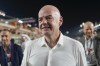 President of FIFA Gianni Infantino walks through the pit-lane prior the Qatar Formula One Grand Prix auto race at the Lusail International Circuit, in Lusail, Qatar, Sunday, Oct. 8, 2023. (AP Photo/Darko Bandic)