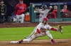 Arizona Diamondbacks' Gabriel Moreno is forced out at first by Philadelphia Phillies first baseman Bryce Harper during the second inning in Game 2 of the baseball NL Championship Series in Philadelphia, Tuesday, Oct. 17, 2023. (AP Photo/Matt Rourke)