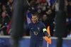 France's Kylian Mbappe celebrates after his teammate Benjamin Pavard scored his side' second goal during the friendly soccer match between France and Scotland at the Pierre Mauroy stadium, in Villeneuve-d'Ascq, northern France, Tuesday, Oct 17, 2023. (AP Photo/Michel Spingler)
