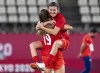 Canada forward Christine Sinclair (12) leaps into the arms of forward Jordyn Huitema (19) to celebrate their win in semifinal football action against the United States of America at the Tokyo Olympics in Kashima, Japan, Monday, Aug. 2, 2020. The star Canadian soccer player has announced her retirement. THE CANADIAN PRESS/ Frank Gunn