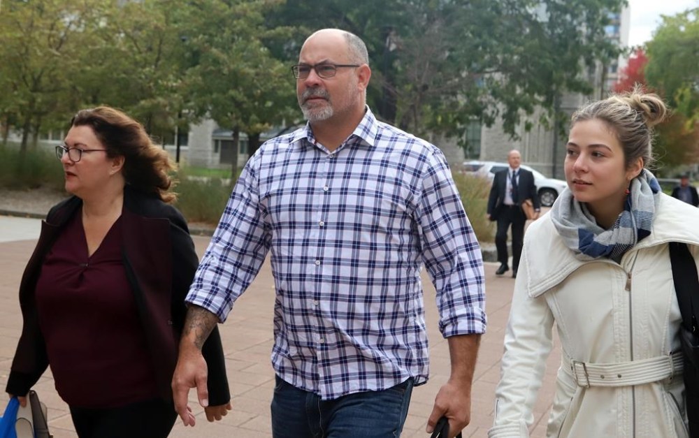 Diane Magas, left, lawyer for Chris Barber, centre, arrive at the courthouse in Ottawa, Monday, Oct. 16, 2023. A police liaison officer who was in touch with organizer Chris Barber during the