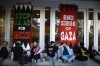 Demonstrators chain themselves by the entrance of the San Francisco Federal Building during a protest in support of Palestinians while calling Israel to cease fire, amidst the ongoing unrest in the Middle East, in San Francisco, Thursday, Oct. 19, 2023 (Stephen Lam/San Francisco Chronicle via AP)
