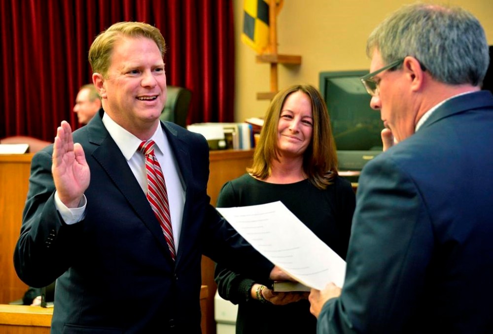 Washington County Circuit Court Clerk Kevin Tucker, right, swears in Andrew F. Wilkinson as a circuit court judge on Jan. 10, 2020, as Wilkinson's wife, Stephanie, watches. Wilkinson was found with apparent gunshot wounds around 8 p.m. Thursday, Oct. 19, 2023, the Washington County Sheriff’s Office said in a statement. Wilkinson was taken from his home in Hagerstown to Meritus Medical Center, where he died of his injuries, the sheriff's office said. ( Julie E. Greene/The Herald-Mail via AP)